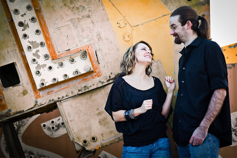 kim and joe wearing black in front of old casino signs